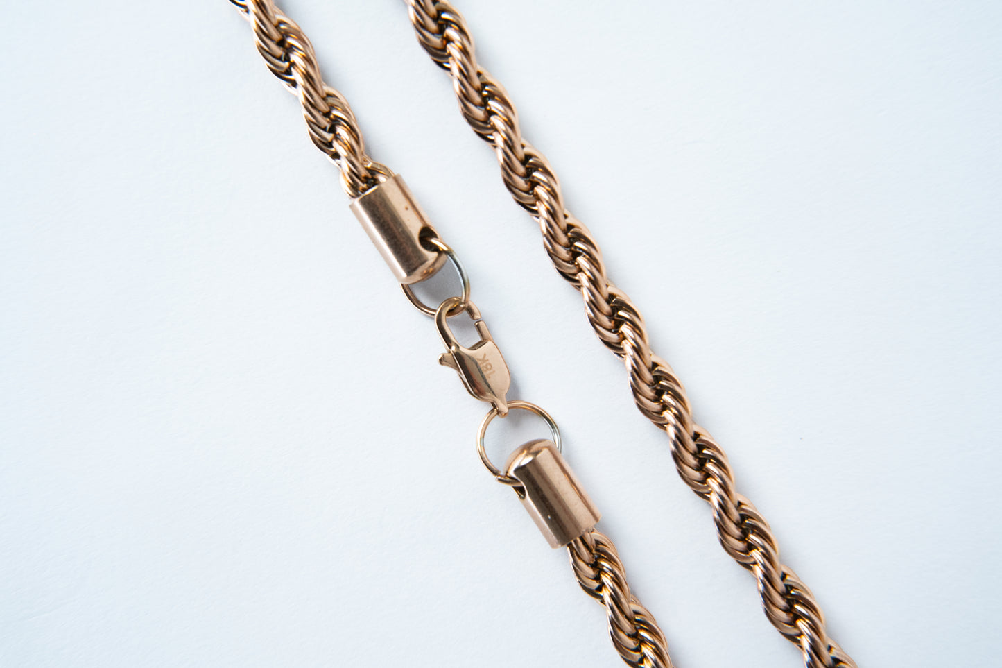 Combo ELYSIUM Cadena mas pulsera Lazo Rosa para caballero