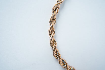 Combo ELYSIUM Cadena mas pulsera Lazo Rosa para caballero